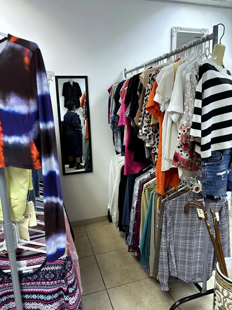 Rails of donated second-hand clothing at Encore, Durban North